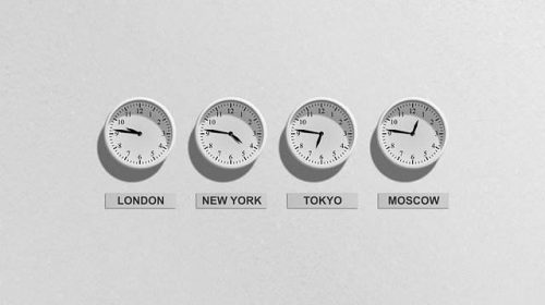 clocks displaying 4 world time zones